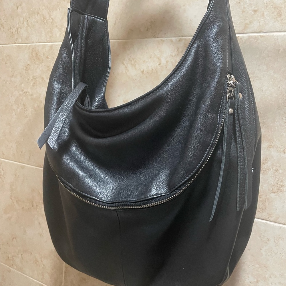 Tano Black Shoulder Bag with Hobo Design . Good condition